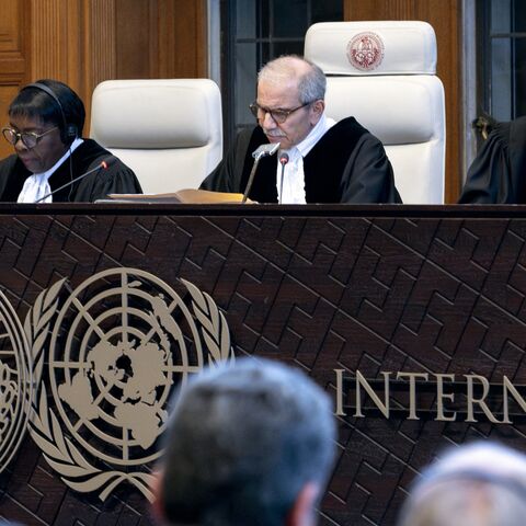 Judge and president of the International Court of Justice (ICJ), Nawaf Salam (2nd R) delivers a nonbinding ruling on the legal consequences of the Israeli occupation of the West Bank and East Jerusalem at the International Court of Justice (ICJ) in The Hague on July 19, 2024. 